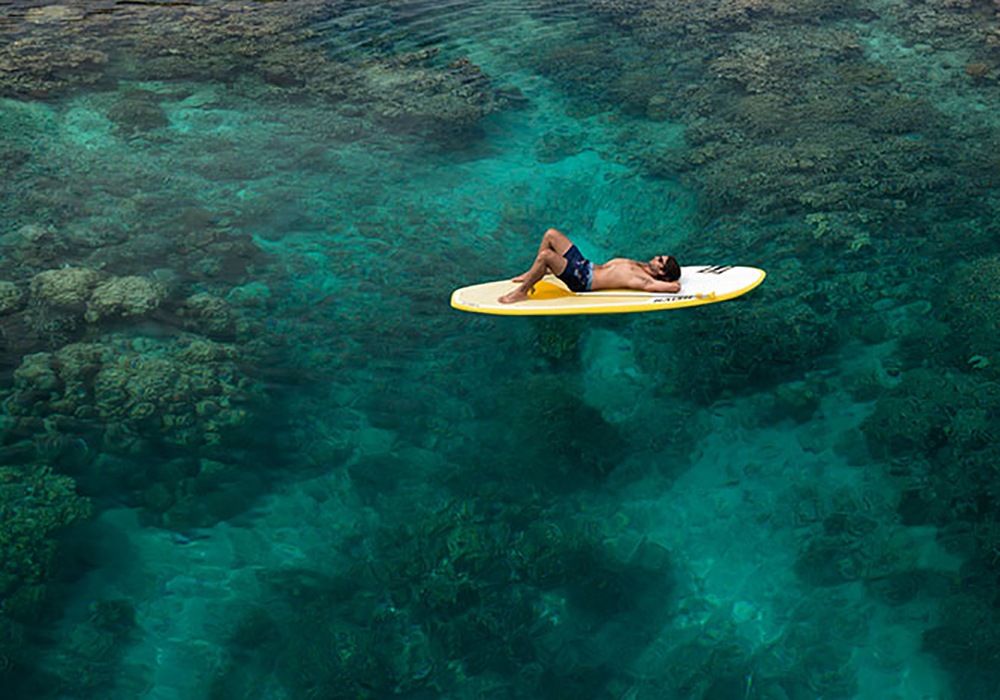 Fiji.  Fiji man paddle board