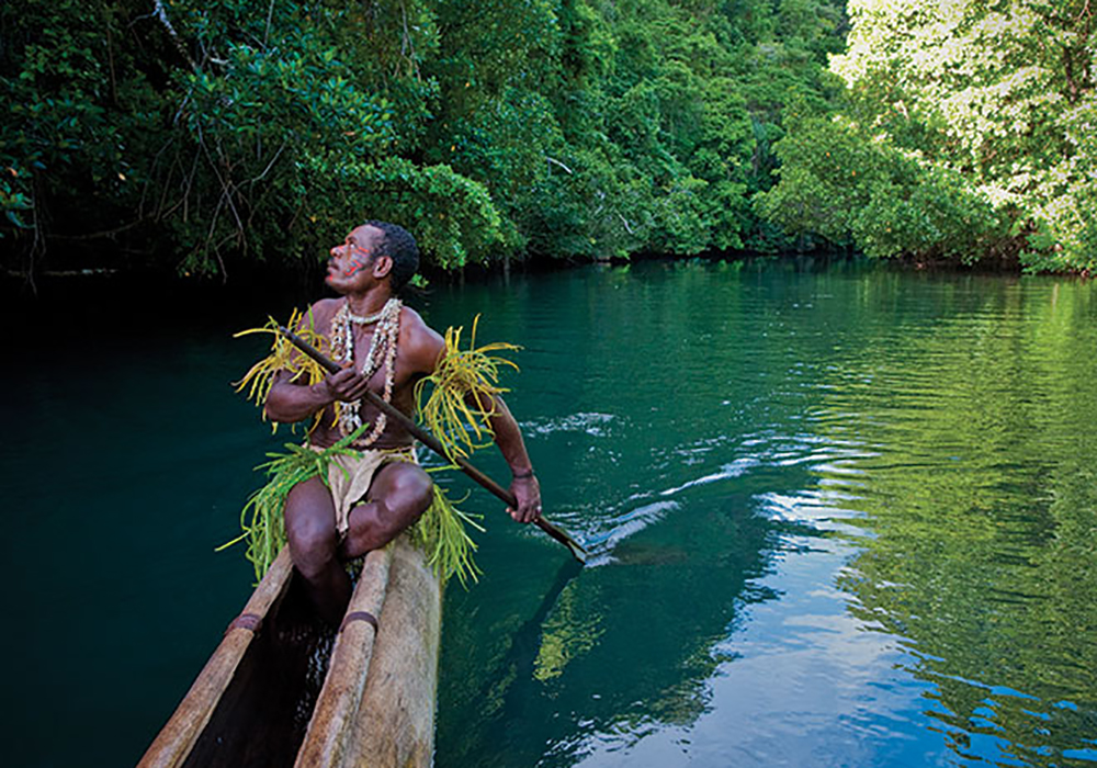Papua nya guinea man canoe
